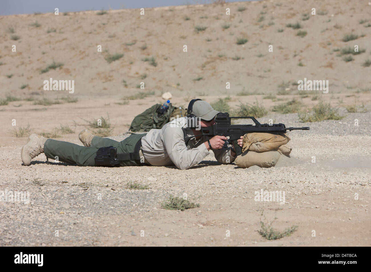 Kunduz, Afghanistan - A U.S. Contractor sights in a German G36 assault rifle. Stock Photo