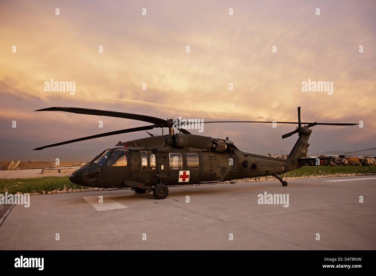 A UH-60L Black Hawk medevac helicopter parked on its pad at the German PRT in Northern Afghanistan. Stock Photo