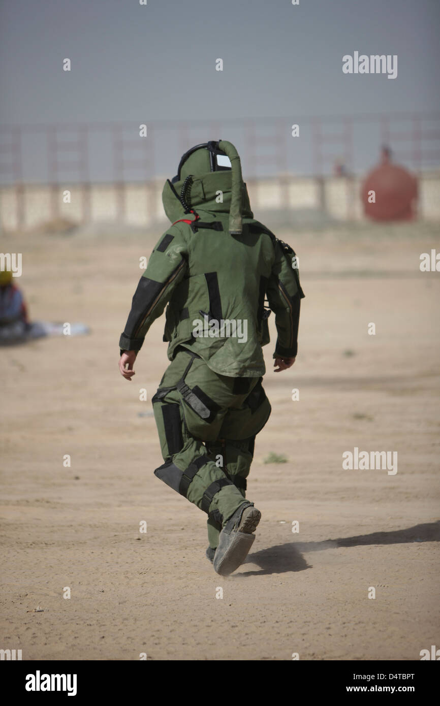 Kunduz, Afghanistan - A U.S. Marine tries running in a German Army EOD blast suit. Stock Photo