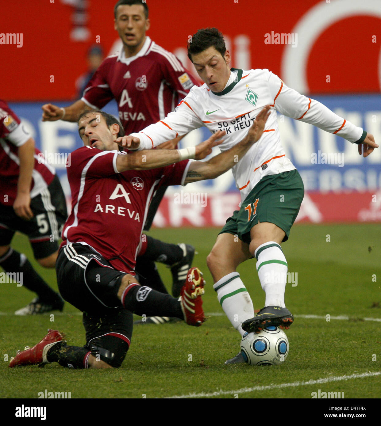 Nuremberg?s Javier Horacio Pinola (L) and Bremen?s Mesut Ozil (R) vie for the ball during the German Bundesliga match Nuremberg vs Werder Bremen at easyCredit Stadion in Nuremberg, Germany, 31 October 2009. Photo: DANIEL KARMANN (ATTENTION: EMBARGO CONDITIONS! The DFL permits the further utilisation of the pictures in IPTV, mobile services and other new technologies no earlier than Stock Photo