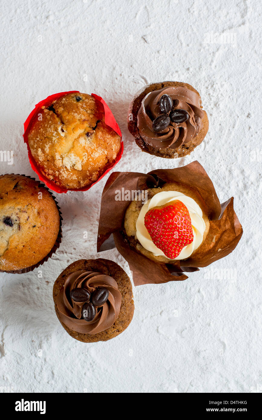 A colourful selection of muffins and cupcakes Stock Photo