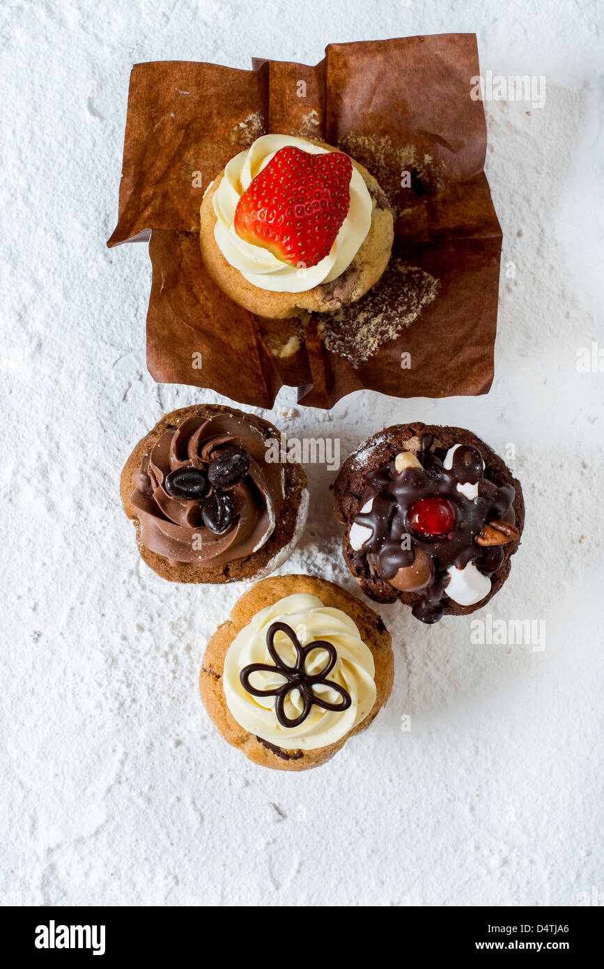 A colourful selection of muffins and cupcakes Stock Photo