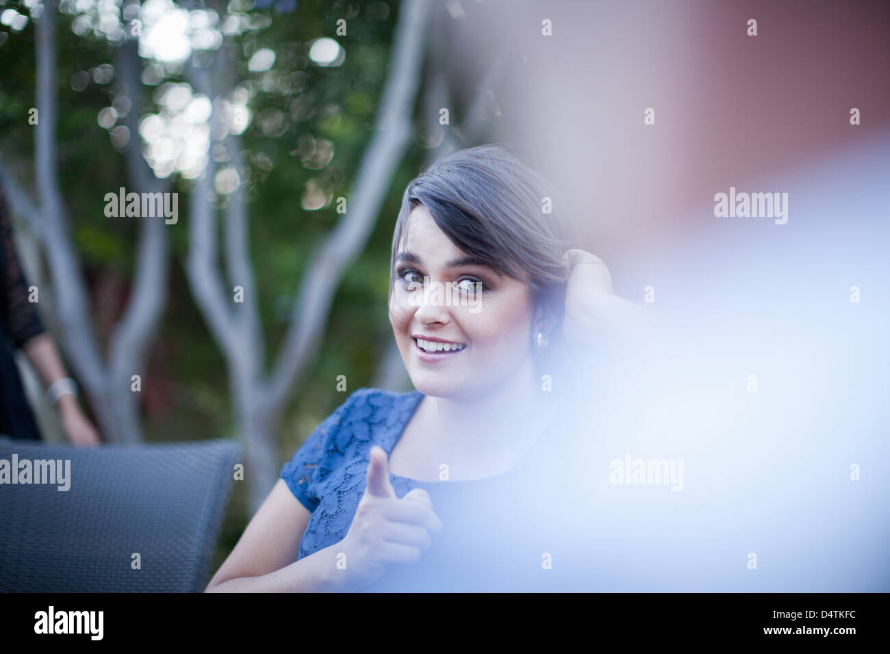 Woman pointing smiling outdoors on hi-res stock photography and images ...