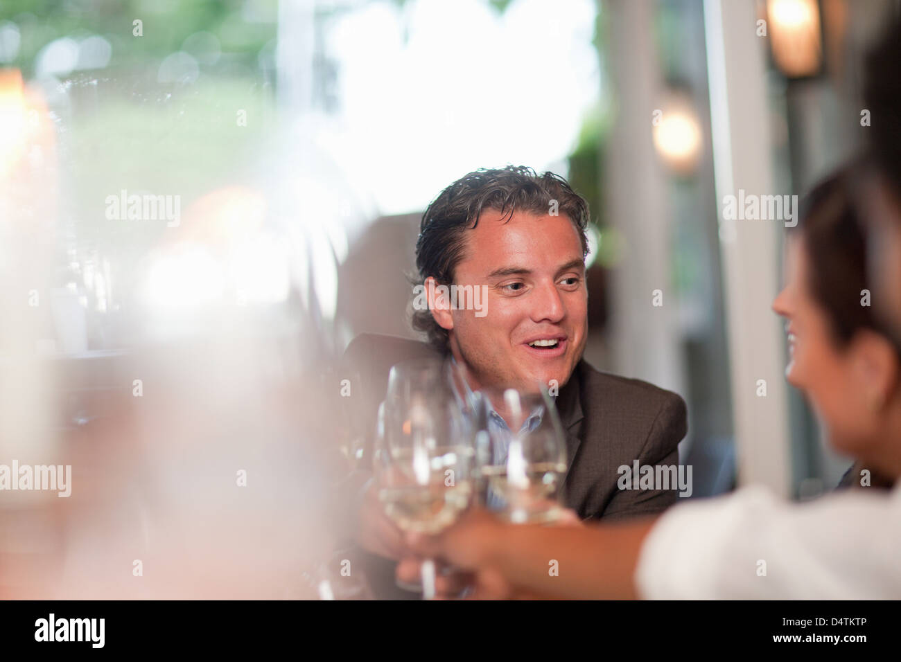 Business people toasting in restaurant Stock Photo