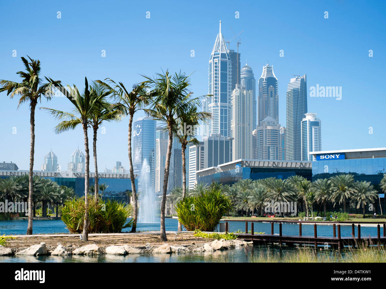 Office buildings and landscaped park and lake at Dubai Internet City in United Arab Emirates UAE Stock Photo