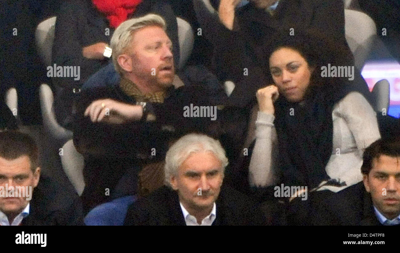Former tennis player Boris Becker (top L), his wife Lilly (top R) and Leverkusen?s sports director Rudi Voeller (bottom C) watch the German Bundesliga match FC Bayern Munich vs Bayer 04 Leverkusen at Allianz Arena stadium in Munich, Germany, 22 November 2009. The match ended in a 1-1 draw. Photo: Peter Kneffel (ATTENTION: BLOCKING PERIOD! The DFL permits the further utilisation of  Stock Photo