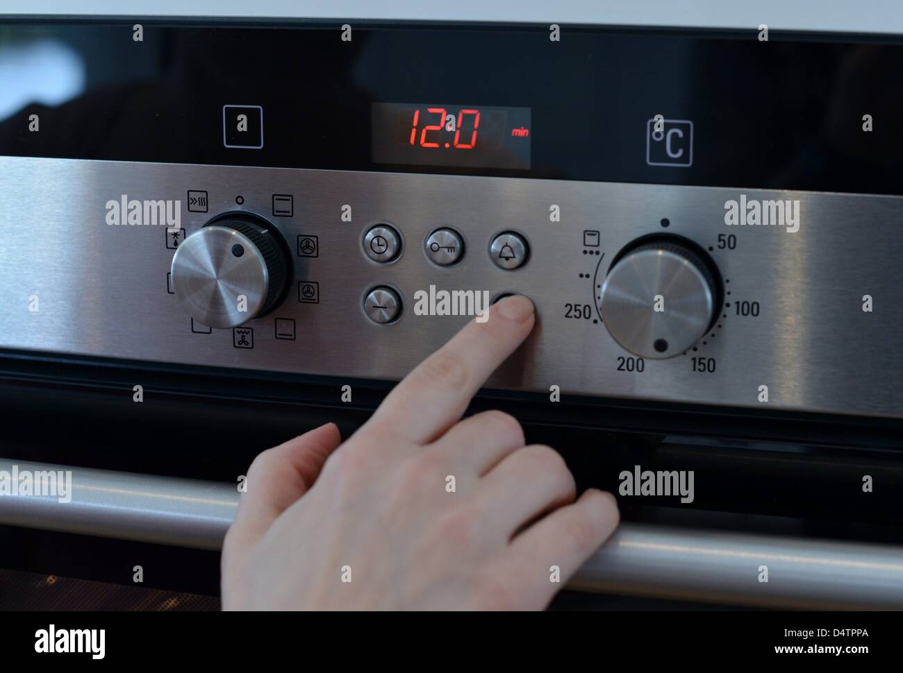 An oven is getting prepared for baking a cake. Photo: Frank May Stock Photo