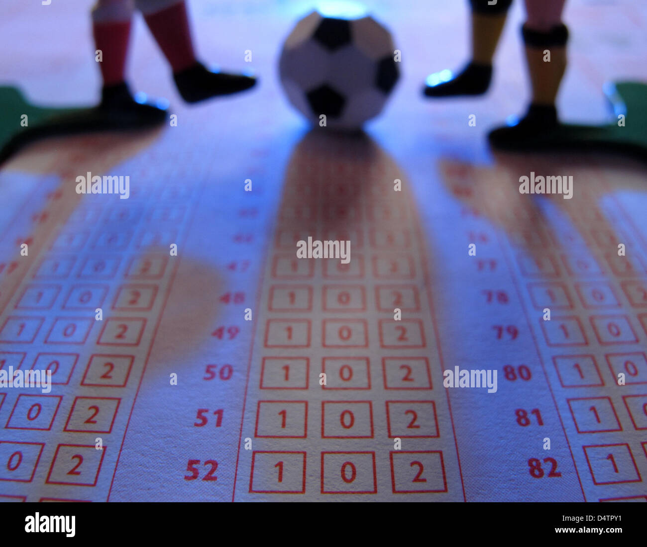 ILLUSTRATION - A 'tip kick' soccer ball and the legs of two 'tip kick ...