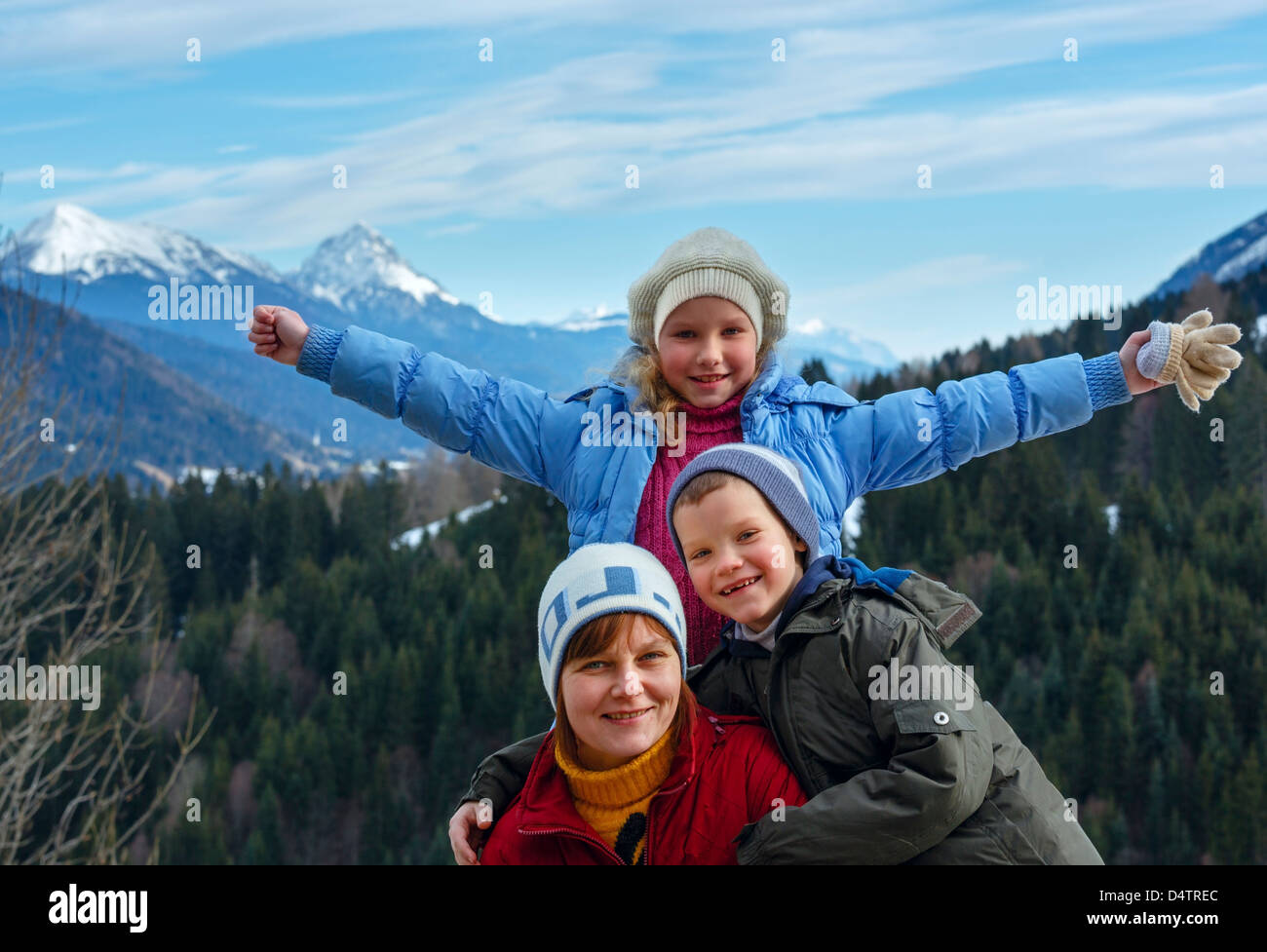 Family on winter mountain background. View from Obergail village outskirts in Lesachtal (Austria). Stock Photo