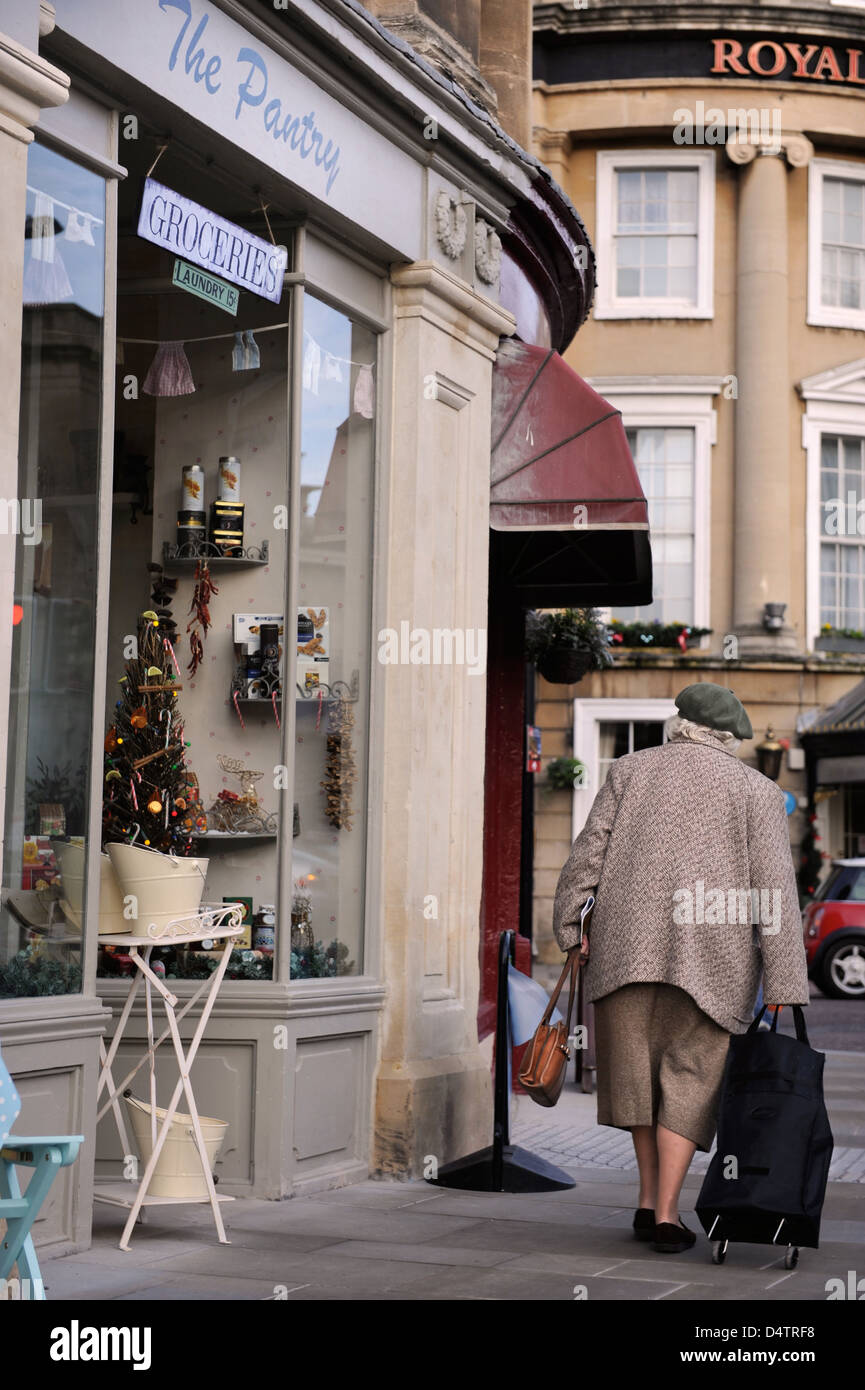 A retired lady shopping in Bath's Dorchester Street UK Stock Photo