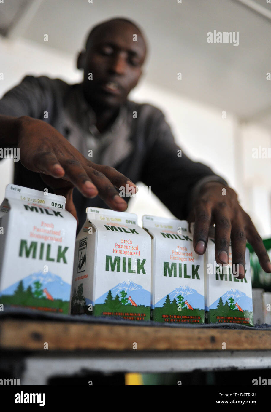 A member of staff packs milk cartons at Doinyo Lessos Creameries Cheese Factory in Eldoret
