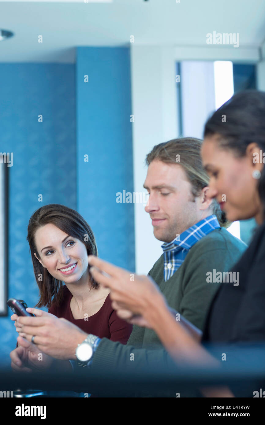 Business people using cell phones Stock Photo - Alamy