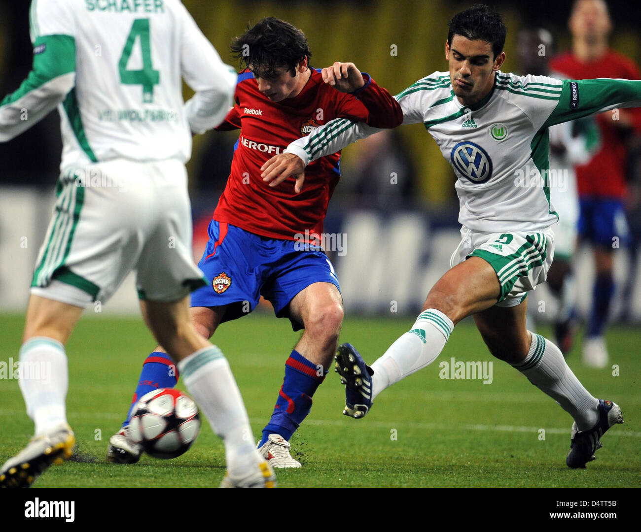 Wolfsburg?s Ricardo Costa (R) and Moscow?s Alan Dzagoev vie for the ball during the Champions League, group B match CSKA Moscow vs VfL Wolfsburg at Luschniki Stadium in Moscow, Russia, 25 November 2009. Photo: Peter Steffen Stock Photo
