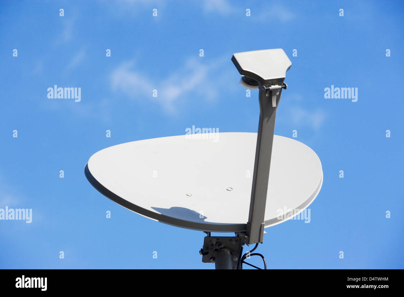 Satellite dish and blue sky Stock Photo