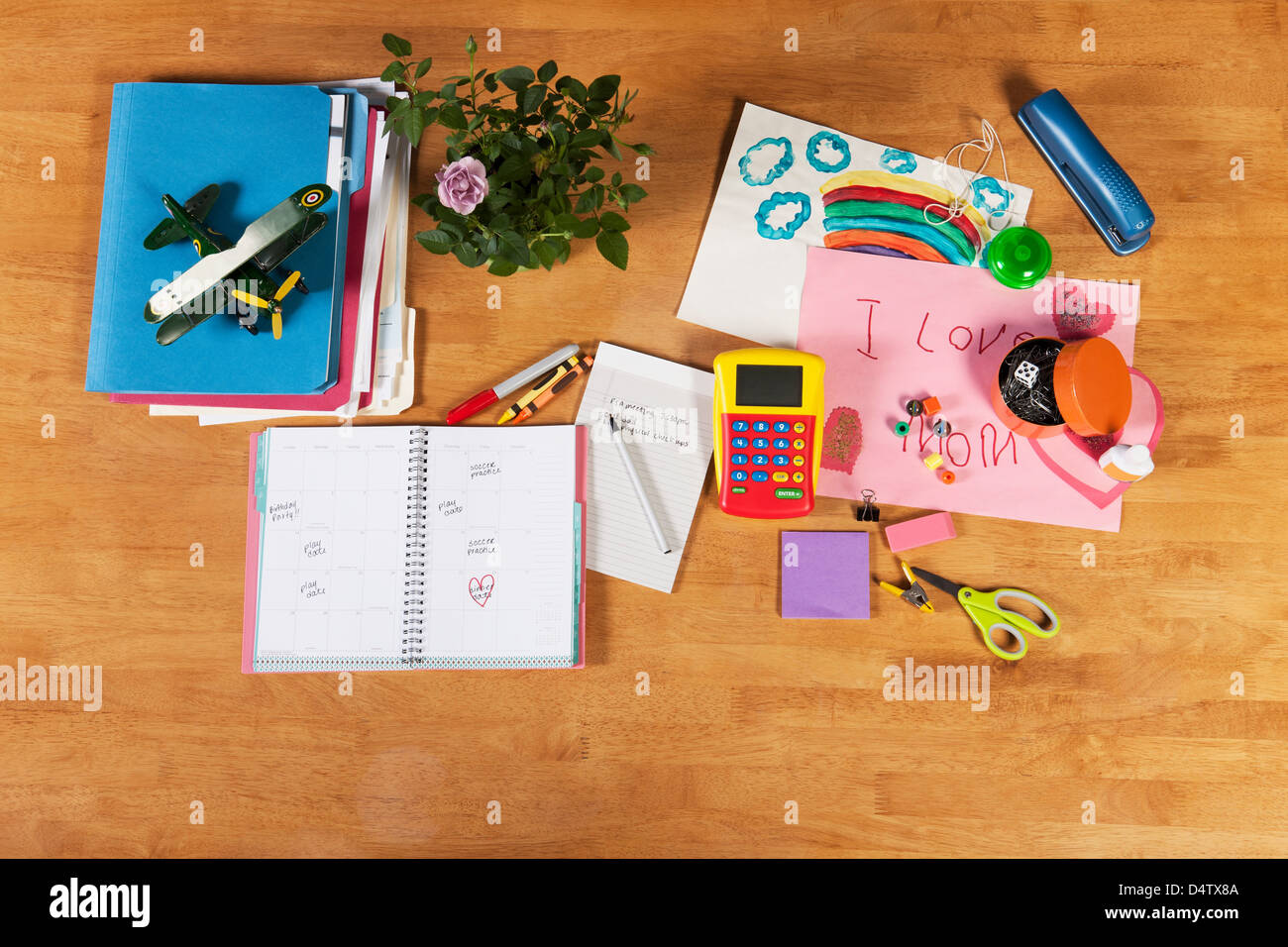 Child's notebooks, pens and toys Stock Photo