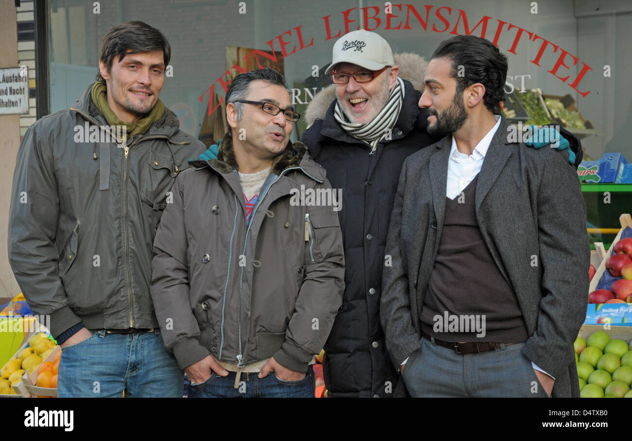 Turkish actor Stipe Erceg (L-R), producer and author Kadir Soezen, director Ben Verbong and Turkish actor Erhan Emre pose for photographers during the shooting of the thriller 'Takiye - Im Namen Gottes' (litt. 'Takiye - In the Name of God') in Duisburg, Germany, 30 November 2009. The film tells the story of a Turkish family breaking apart as it becomes involved in a criminal organi Stock Photo