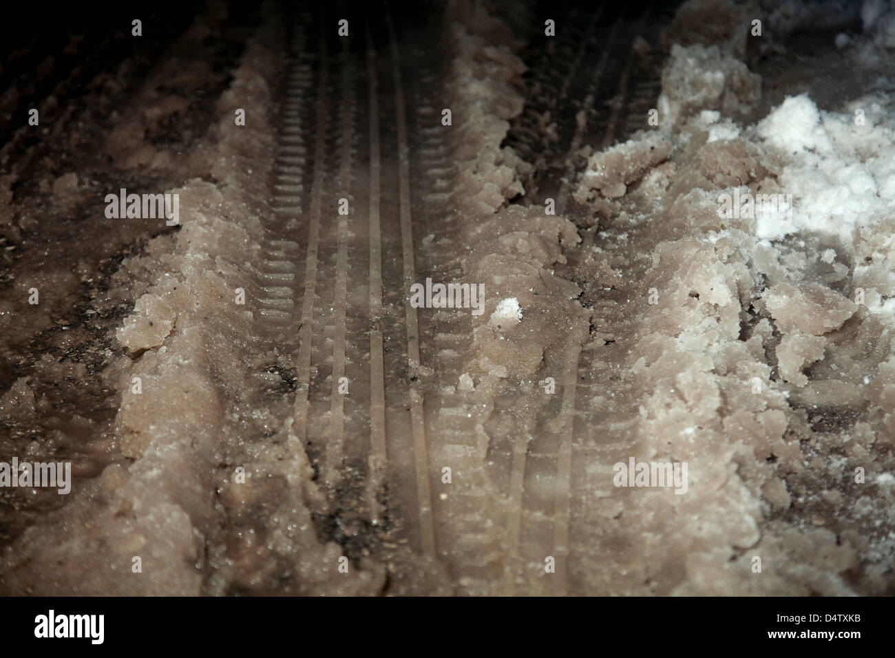 Close up of tire tracks in snow slush Stock Photo