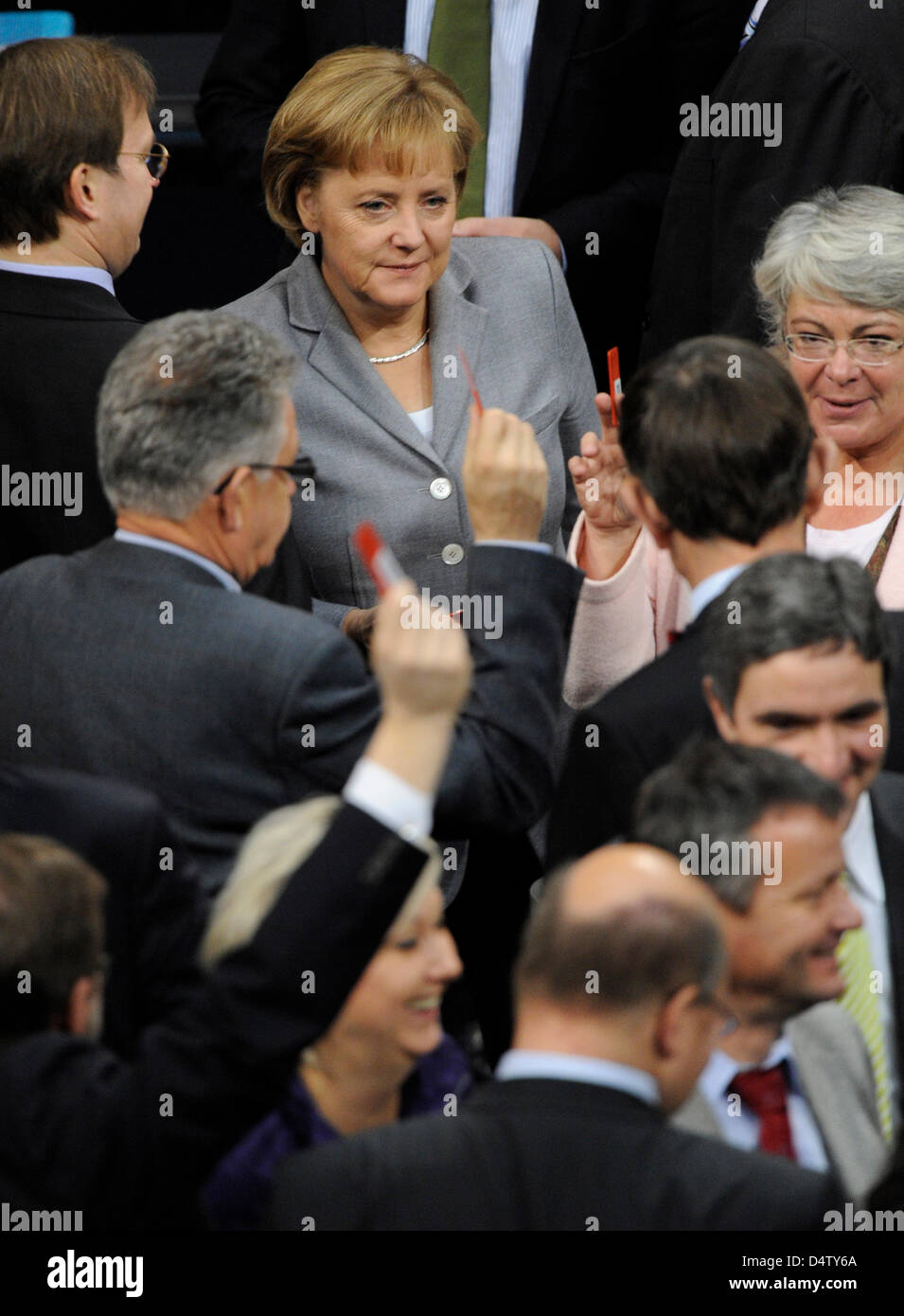 German Chancellor Angela Merkel steps forward to cast her vote on the contested tax package at the Bundestag in Berlin, Germany, 04 December 2009. An assent with the majority of CDU/CSU and FDP appears certain. Families, companies and heirs are to be relieved of up to 8.5 billion euro of taxes. Photo: Rainer Jensen Stock Photo
