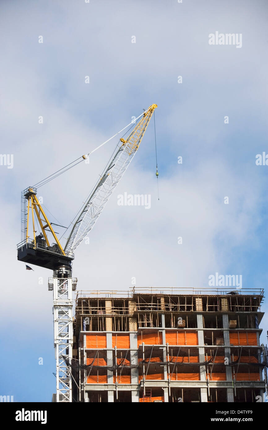 Crane over building in construction Stock Photo Alamy