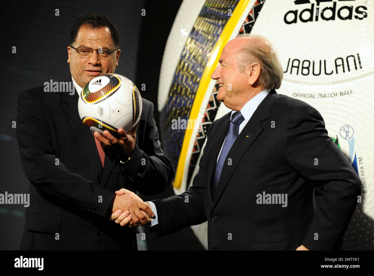 FIFA President Joseph Blatter (R) hands Jabulani, the official ball for the FIFA 2010 World Cup South Africa, to Danny Jordaan (L), managing director of the organisation committee, in Cape Town, South Africa, 04 December 2009. Jabulani is produced by German company adidas. Photo: BERND WEISSBROD Stock Photo