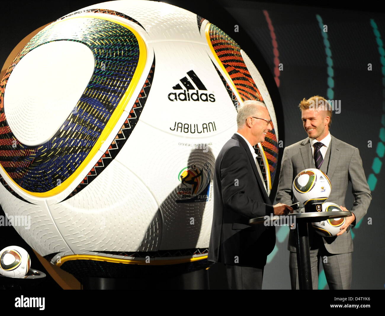 German soccer legend Franz Beckenbauer (L), president of the 2006 FIFA World Cup Germany, chats with England international David Beckham (R) as Jabulani, the official ball for the FIFA 2010 World Cup South Africa is handed over in Cape Town, South Africa, 04 December 2009. Jabulani is produced by German company adidas. Photo: BERND WEISSBROD Stock Photo