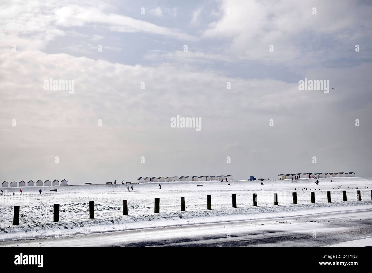 Snow and beach huts at the Green Sward, Goring, West Sussex, UK Stock Photo