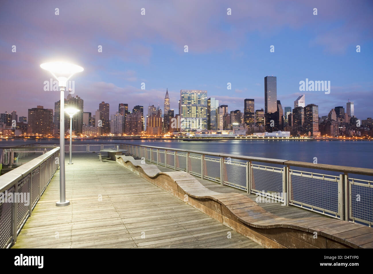 New York City skyline lit up at dusk Stock Photo - Alamy