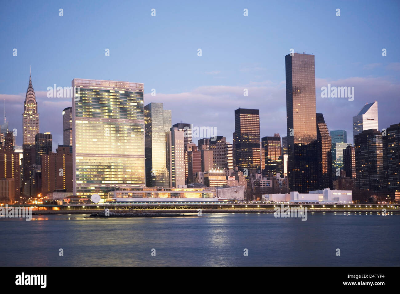 New York City skyline lit up at dusk Stock Photo - Alamy