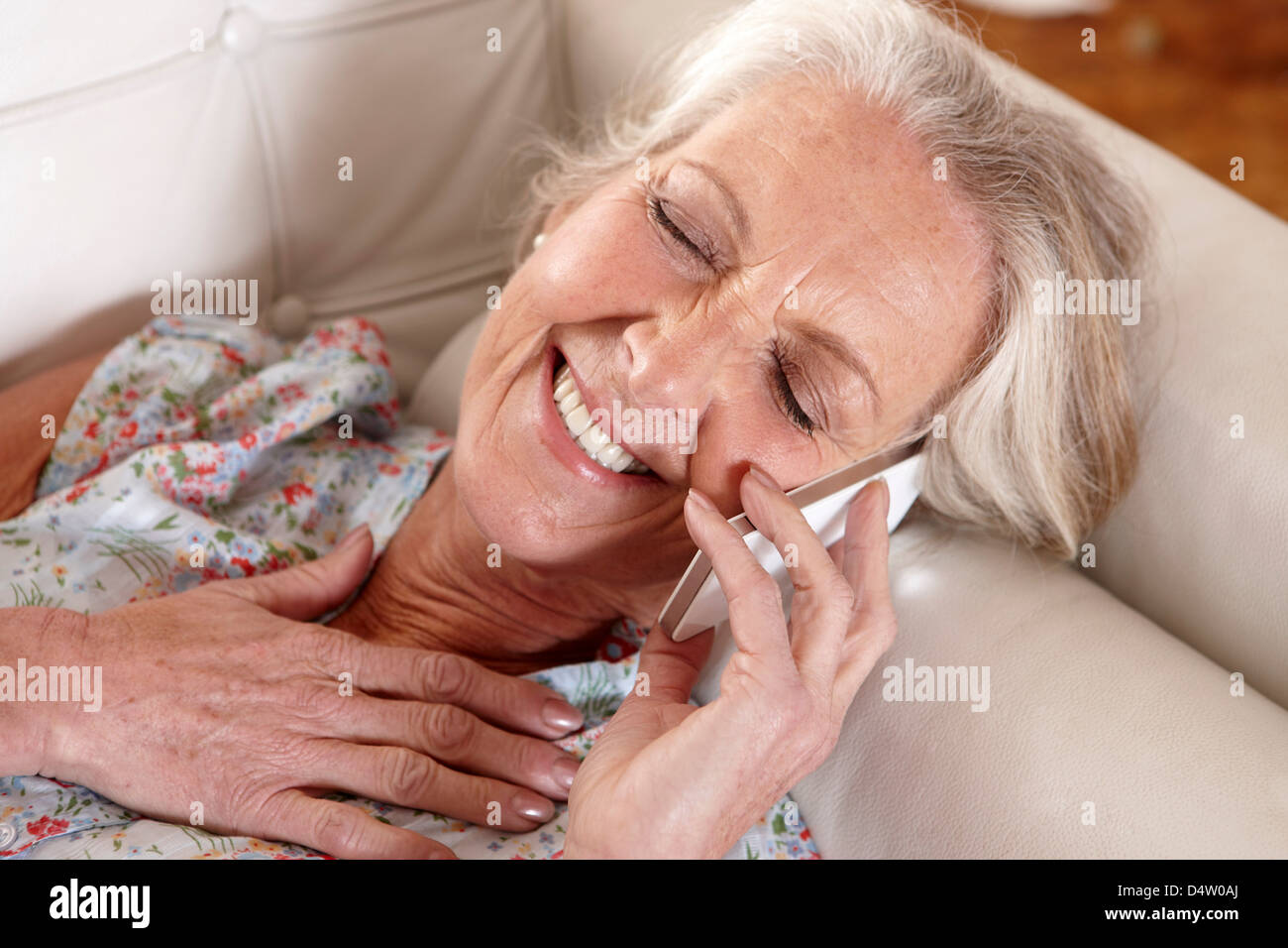 Older woman talking on cell phone Stock Photo - Alamy