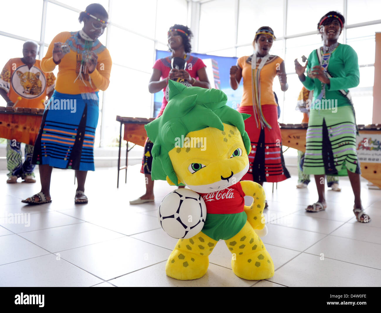 Dancers and Zakumi, mascot of FIFA 2010 World Cup, at Nelson Mandela Bay stadium in Port Elizabeth, South Africa, 06 December 2009. The stadium will be the venue for five group matches, one round of 16 match, a quarter-finals match and the third-place match during the FIFA 2010 World Cup. Photo: Bernd Weissbrod Stock Photo