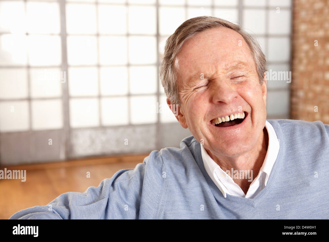 Close up of older man's laughing face Stock Photo