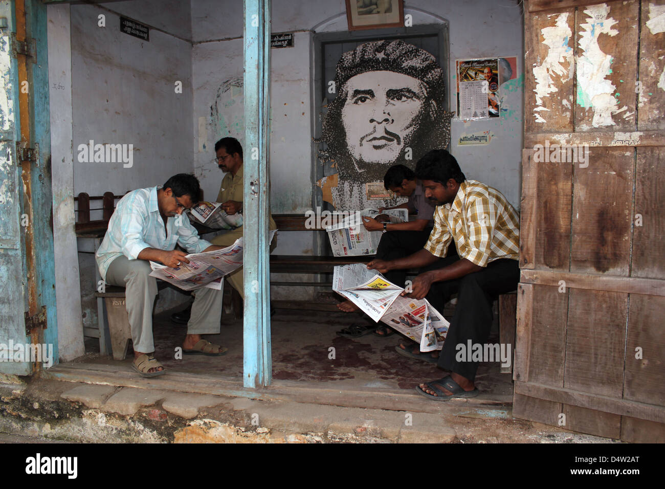 men reading newspapers in Cochin India Stock Photo