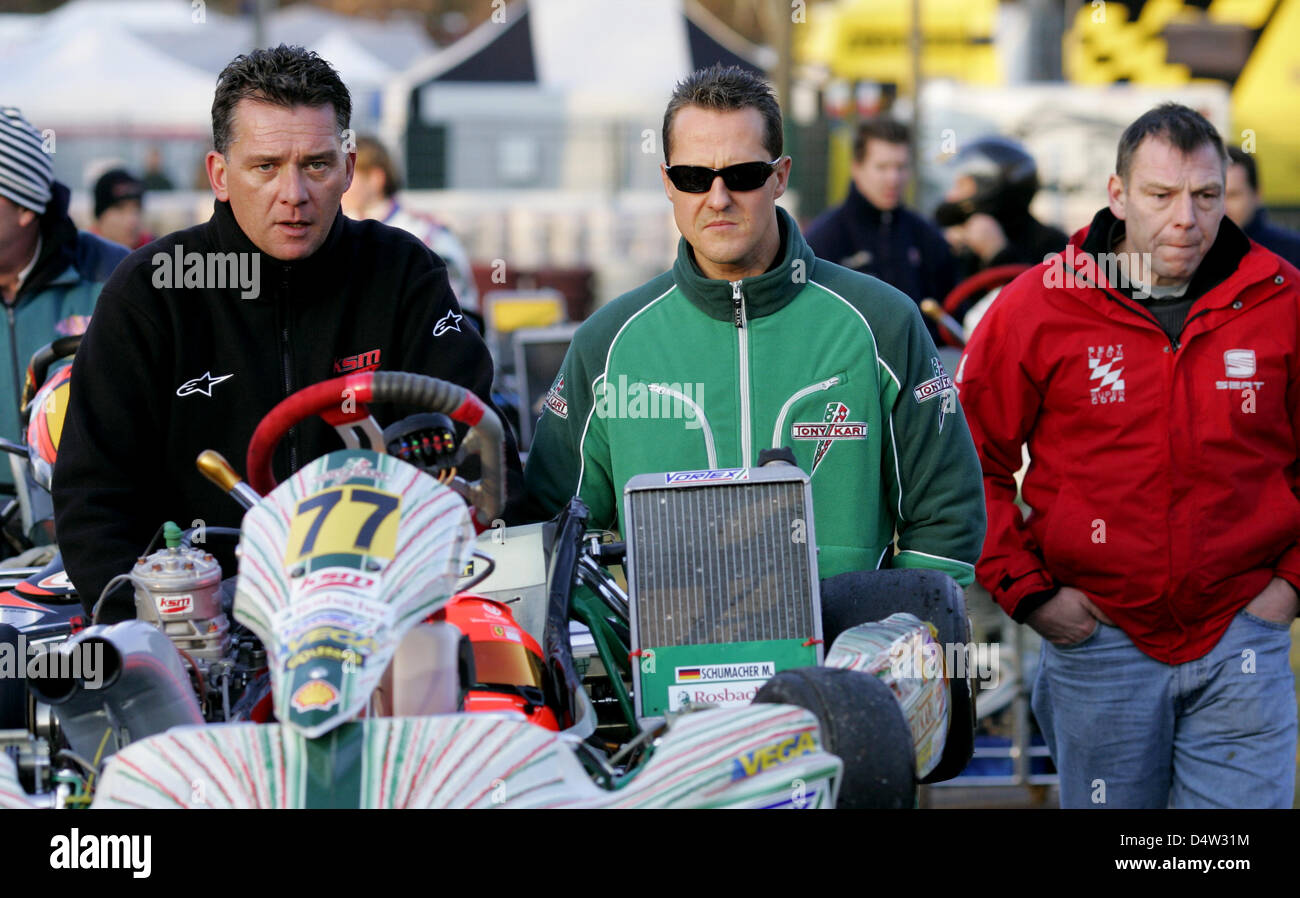 Michael Schumacher (C) and his friend Peter Kaiser (L) on the sidelines of Winter Cup cart race staged by the Kart-Club in Kerpen, 13 December The Formula One record