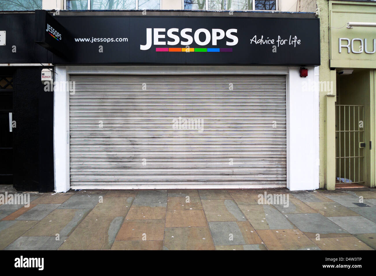 Closed Jessops shopfront with sign offering 'Advice for LIfe' Upper Street Islington London UK 2013 Stock Photo