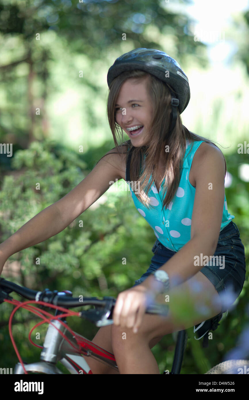 Teenage girl riding mountain bike Stock Photo