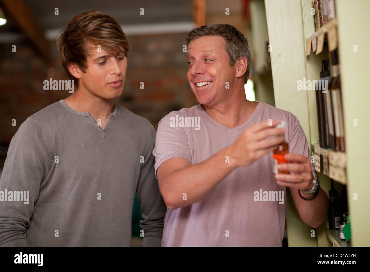 Father and son shopping for wine Stock Photo - Alamy