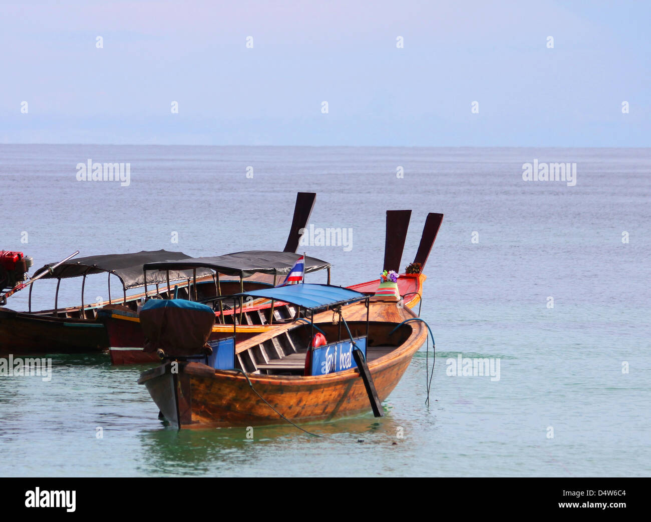 A photograph of some Thai long-tail boats. Taken on the island of Koh Lipe in Thailand. Stock Photo