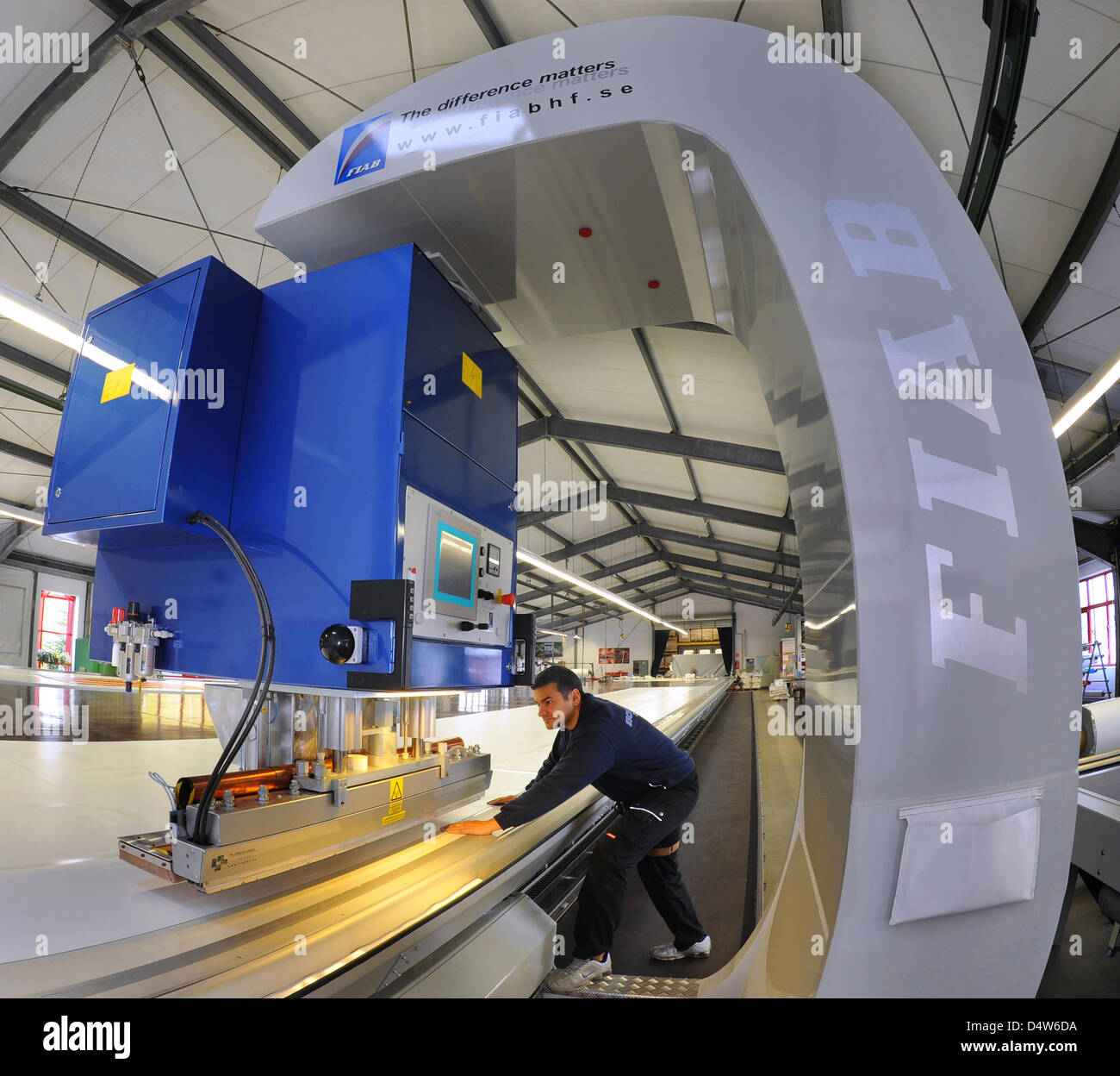 Master Denis Master Denis Aucio operates a high frequency welding machine which ...