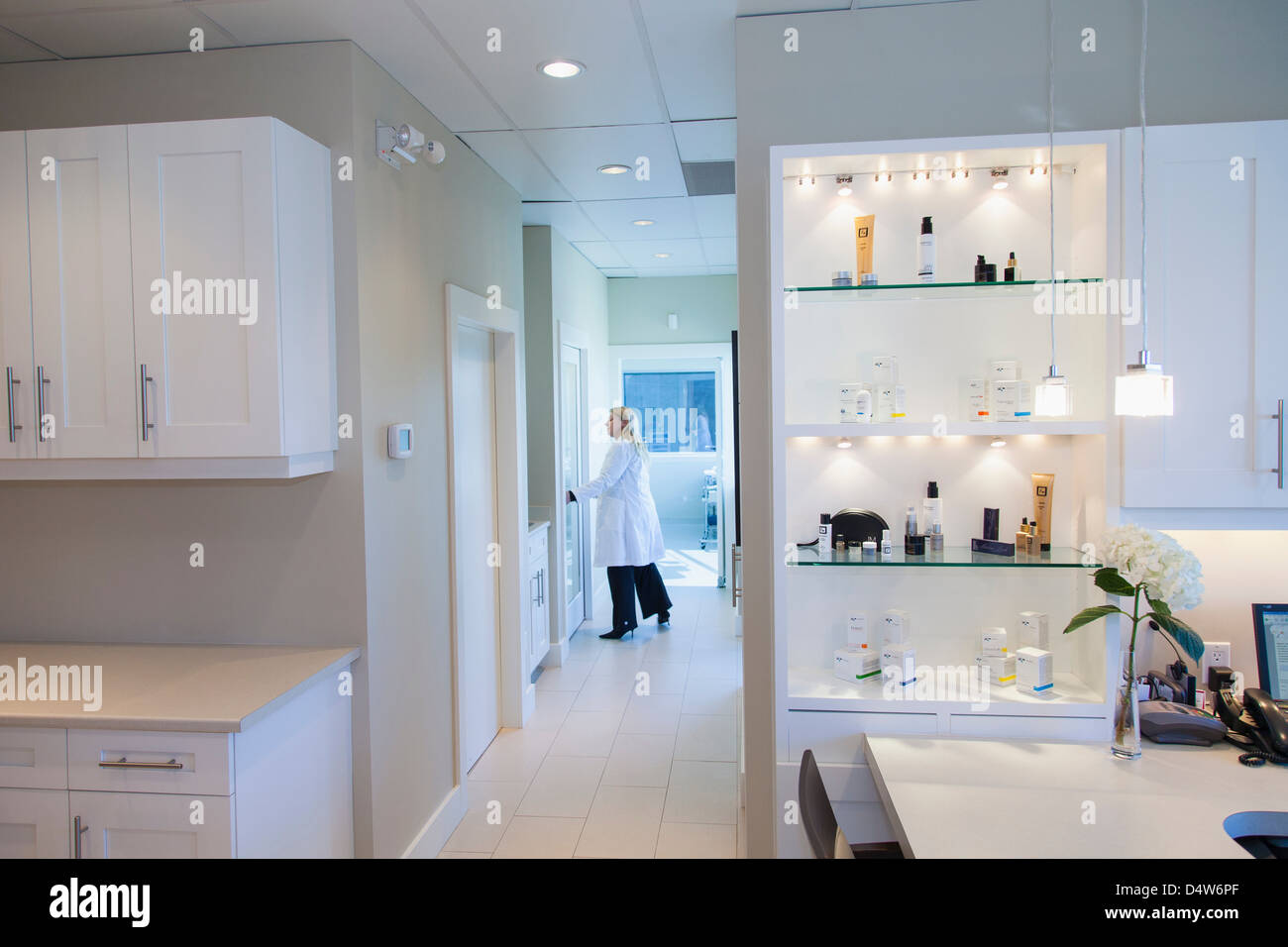 Doctor walking in office hallway Stock Photo Alamy
