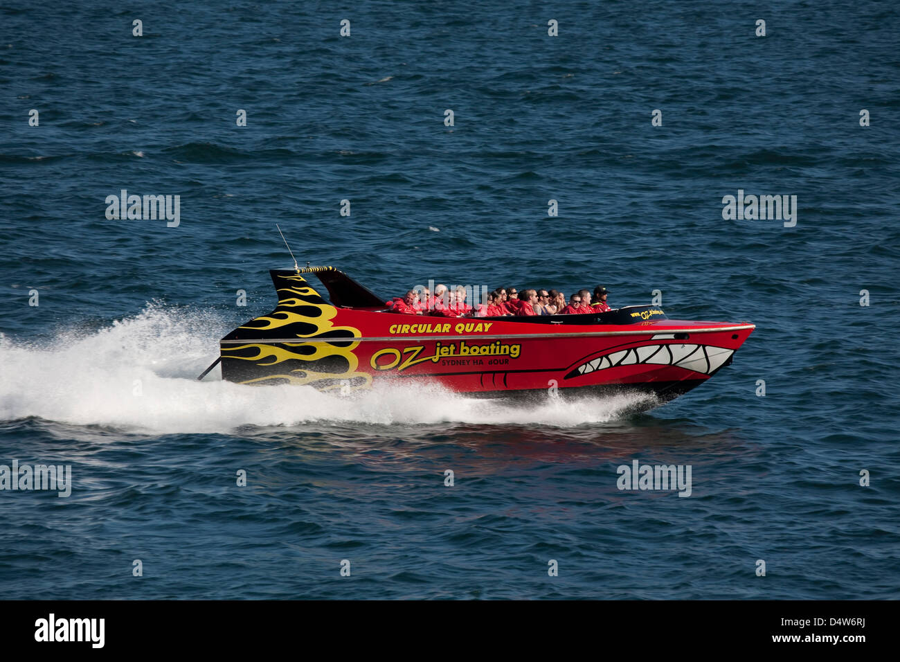 Oz jet boating tourists at high-speed across Sydney harbour Sydney New South Wales Australia Stock Photo