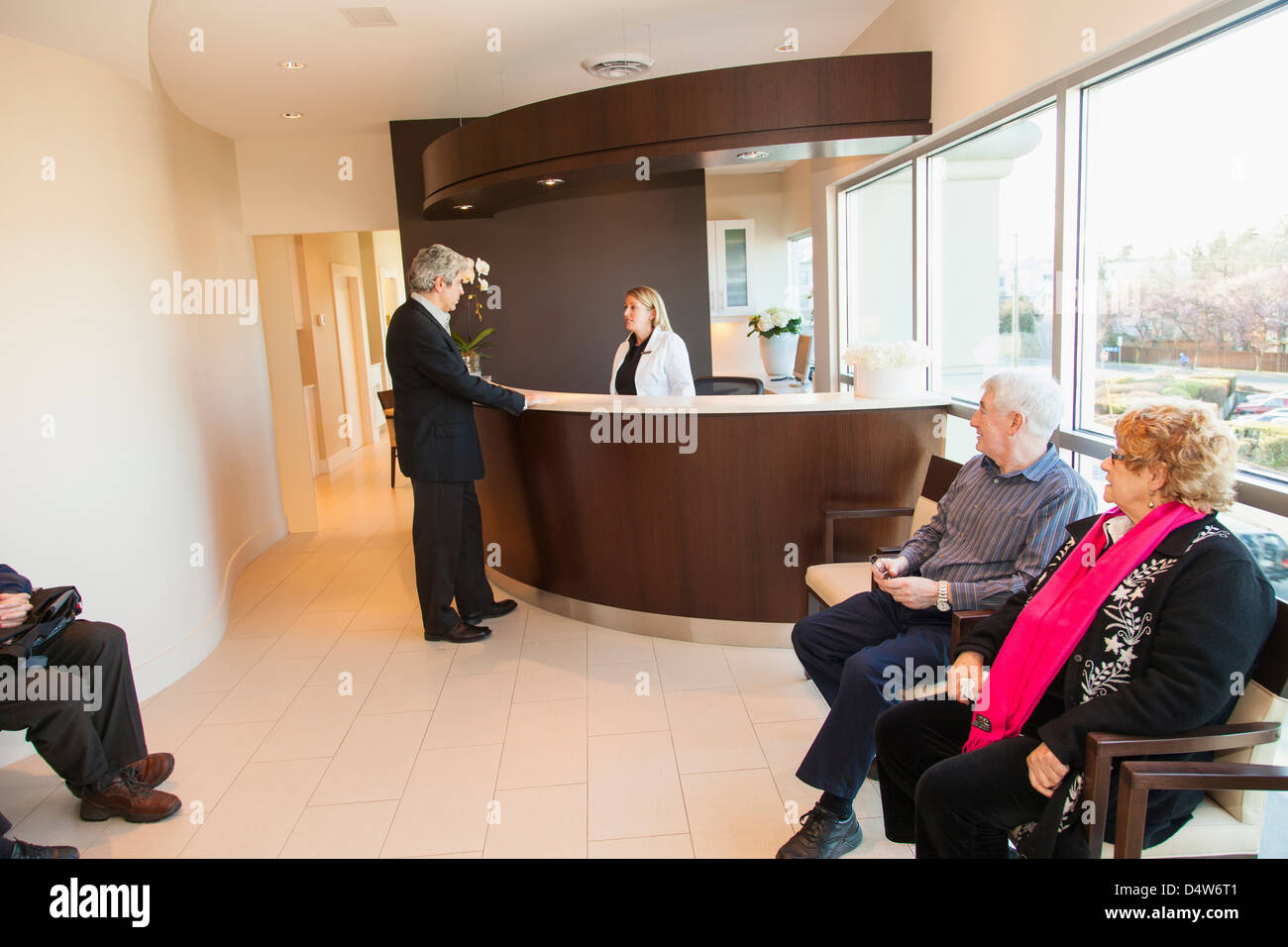 Patients in doctor's waiting room Stock Photo Alamy