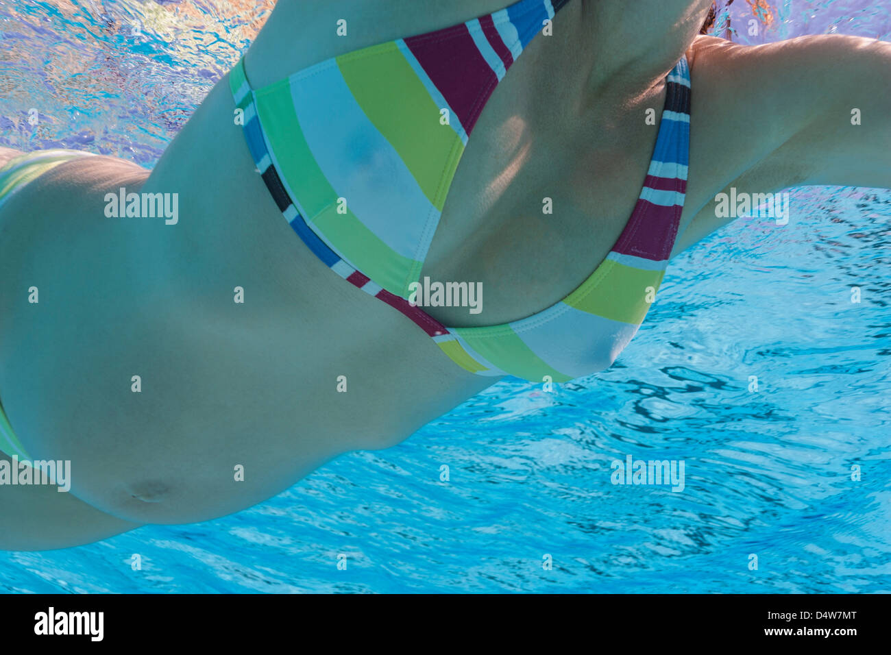 Pregnant woman swimming in pool Stock Photo Alamy