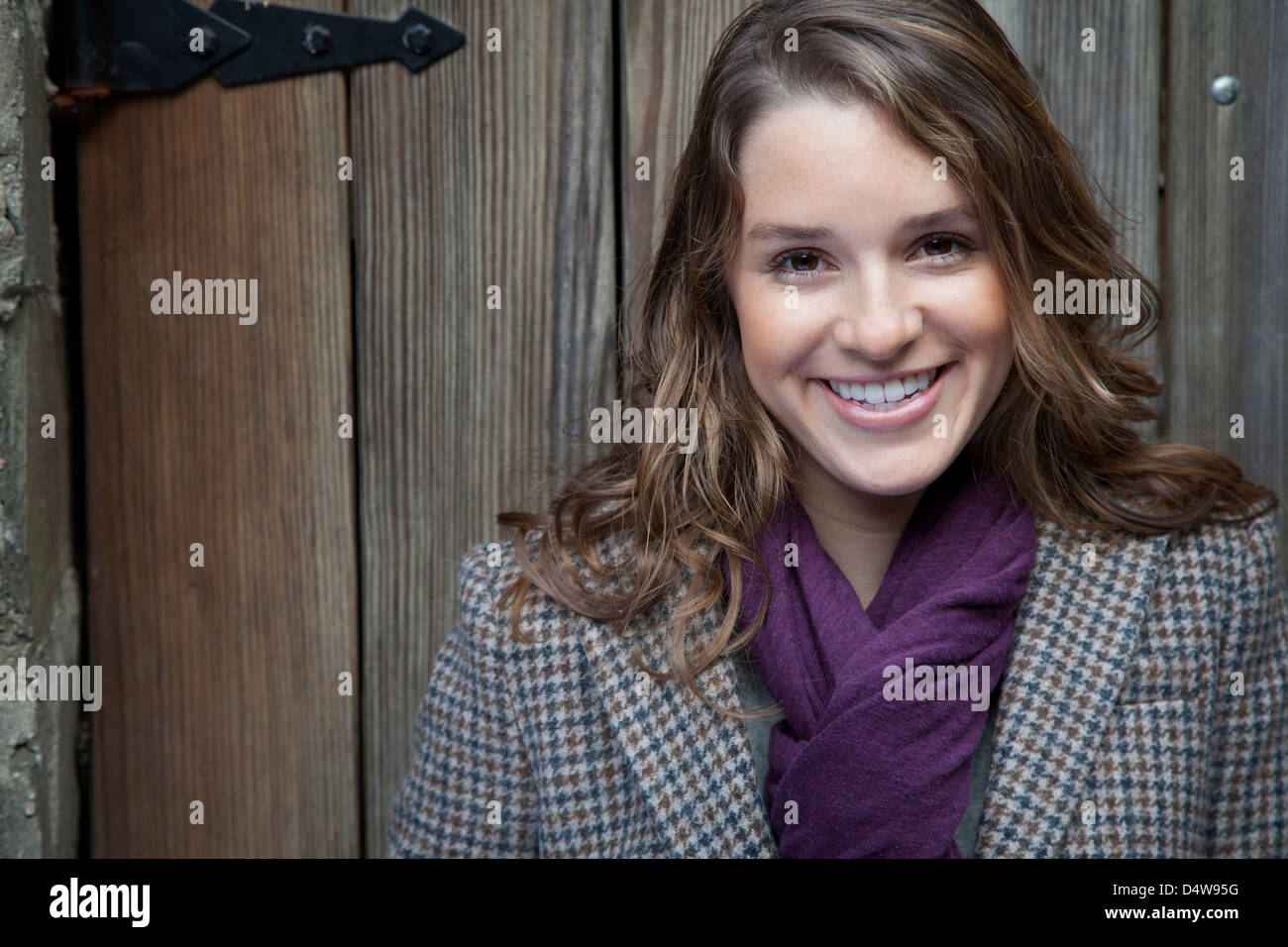Smiling woman wearing purple scarf Stock Photo