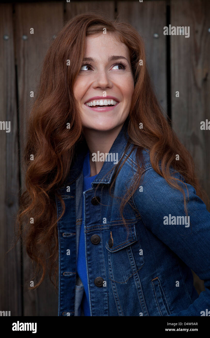 Smiling woman standing outdoors Stock Photo - Alamy