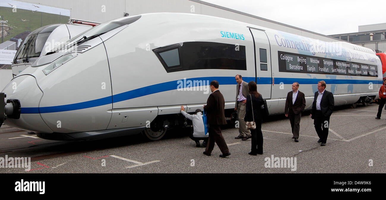 Visitors eye a ICE 3 highspeed train at InnoTrans trade fair in Berlin ...