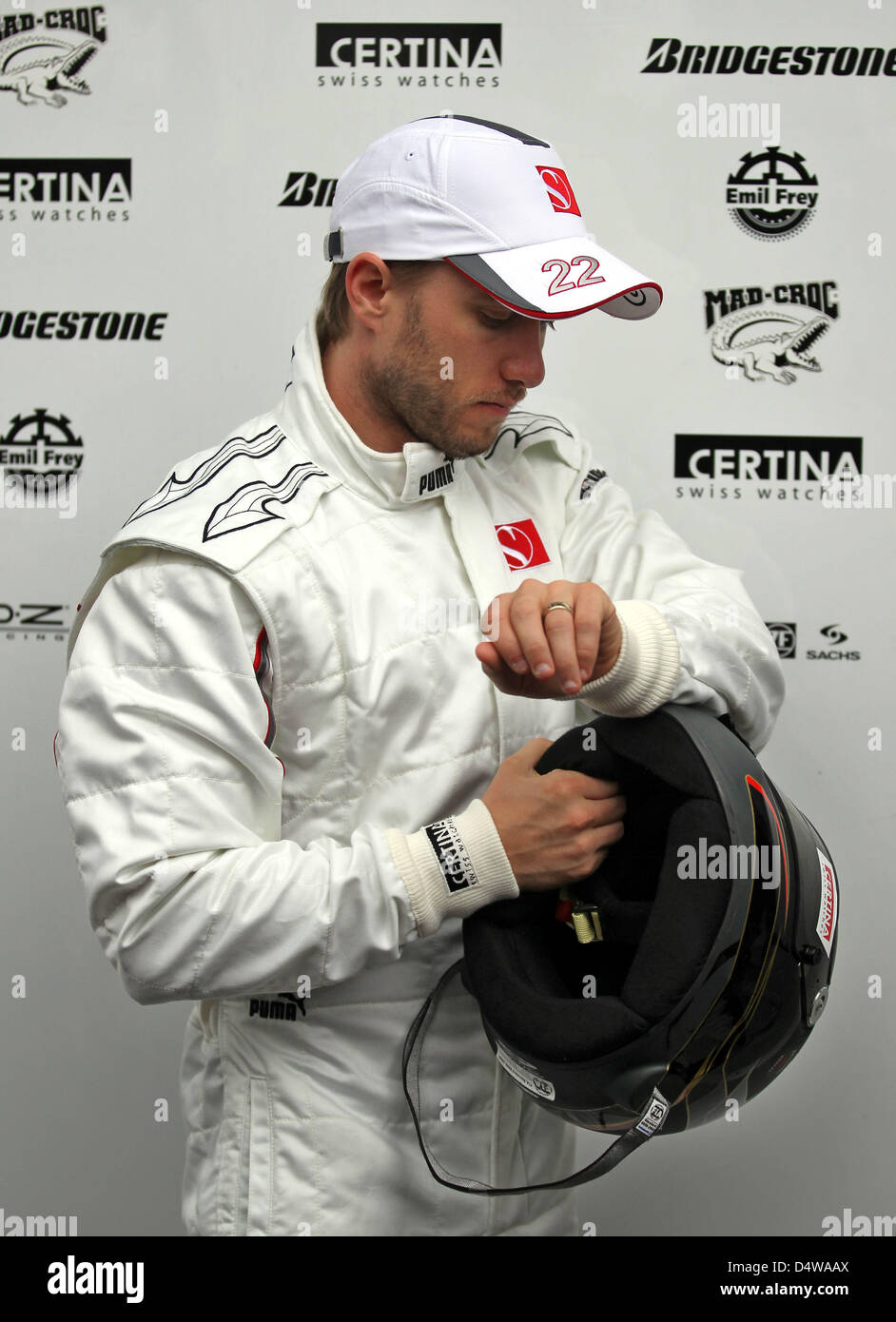 German Formula One driver Nick Heidfeld of Sauber polishes his helmet