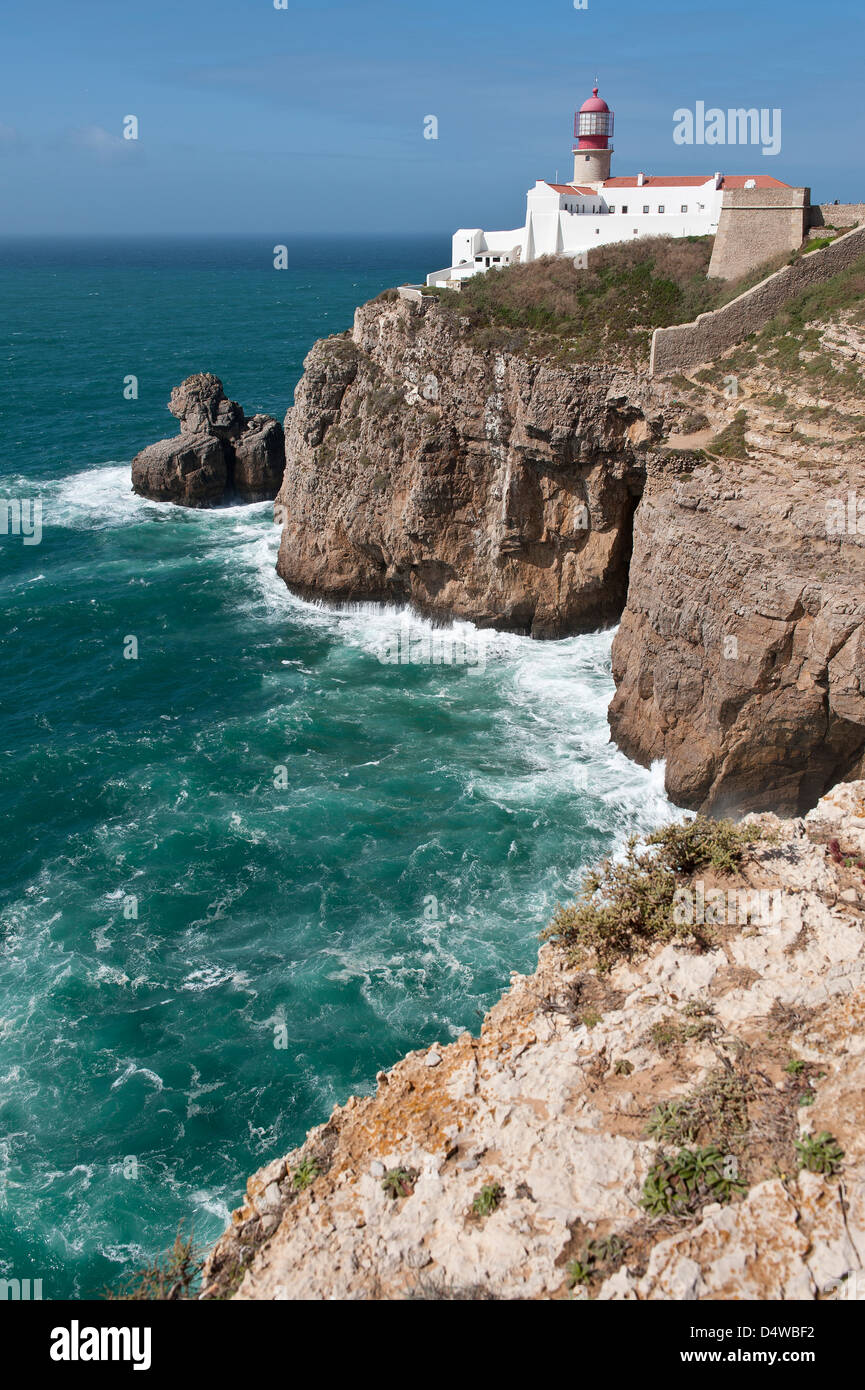 Lighthouse on solitary cliff, facing the Atlantic Ocean, Cabo de Sao Vicente the Costa Vicentina Park Algarve Portugal Europe Stock Photo