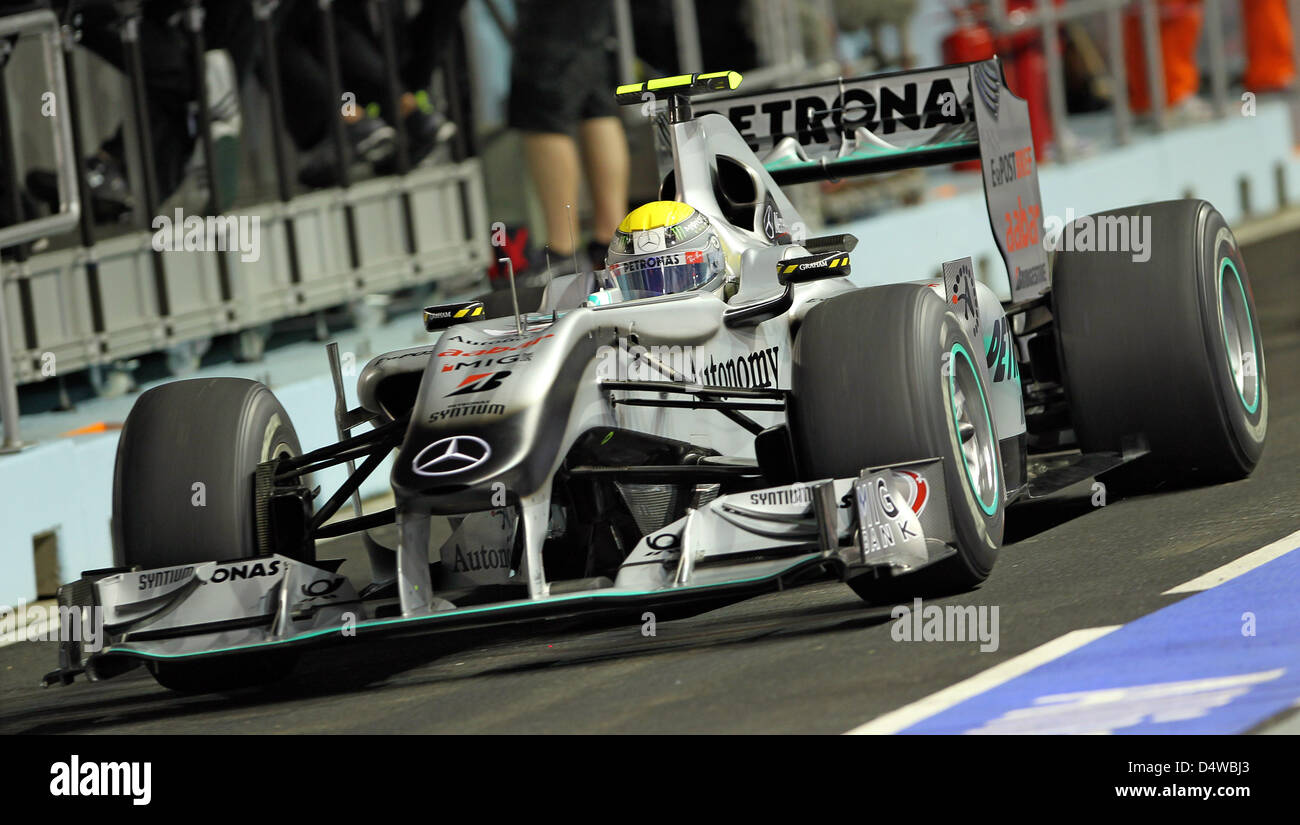 German driver Nico Rosberg of Mercedes GP drives through the pit lane Stock Photo - Alamy