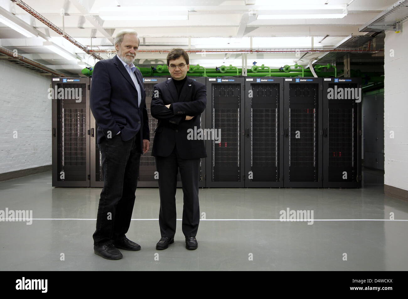 A handout picture from 19 November 2010 shows the developers of the new supercomputer LOEWE-CSC, Volker Lindenstruth (r) and Hans Juergen Luedde, at the Center for Scientific Computing which is part of Goethe University in Frankfurt, Germany. Germany's second fastest computer with an output of 285 billions of arithmetic operations per second has been commissioned in Frankfurt. It h Stock Photo