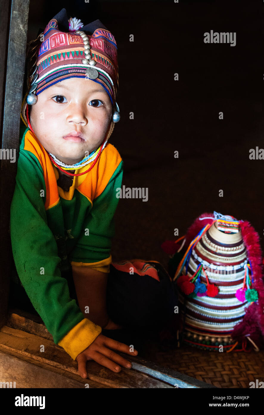 A child from Akha tribal village wearing traditional clothes, near ...